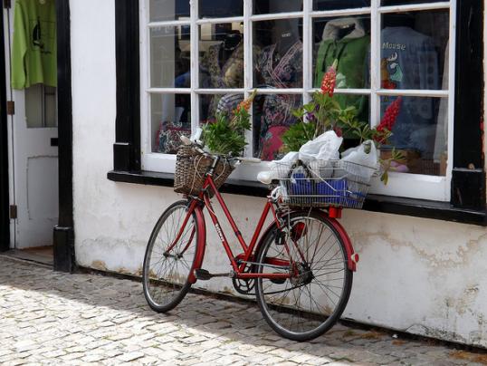 Bike resting on a shop front
