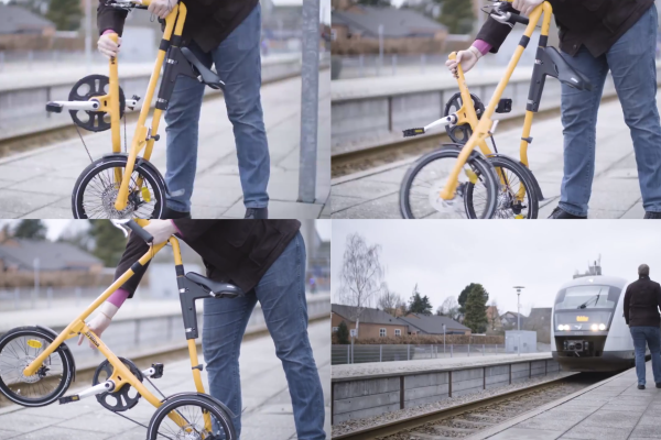 Cyclist folds bike to be brought onto a train